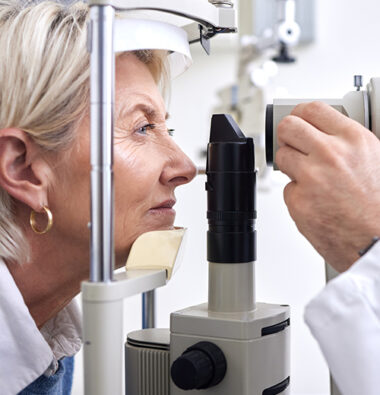 Optometry, machine exam and woman with an optometrist for a vision check, eye consultation and test.